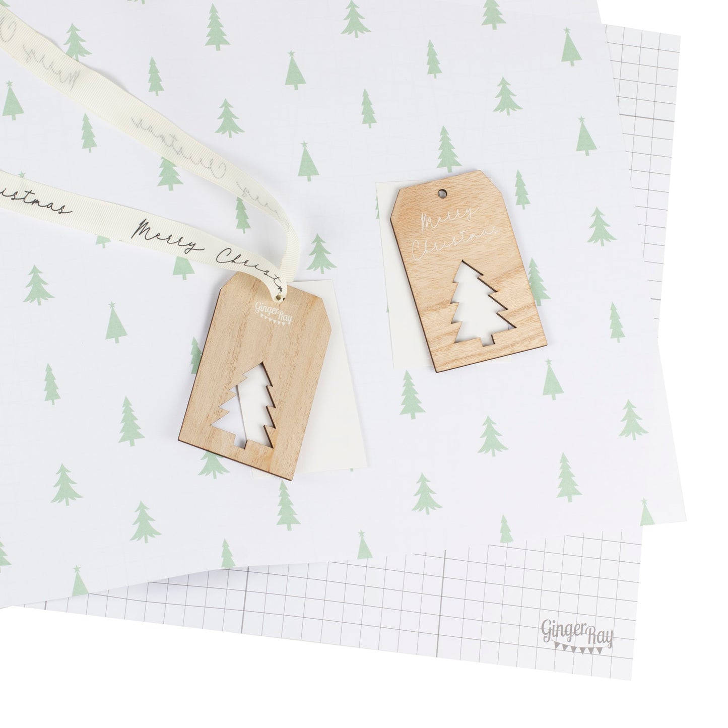 Christmas wrapping paper with ribbon and wooden tag